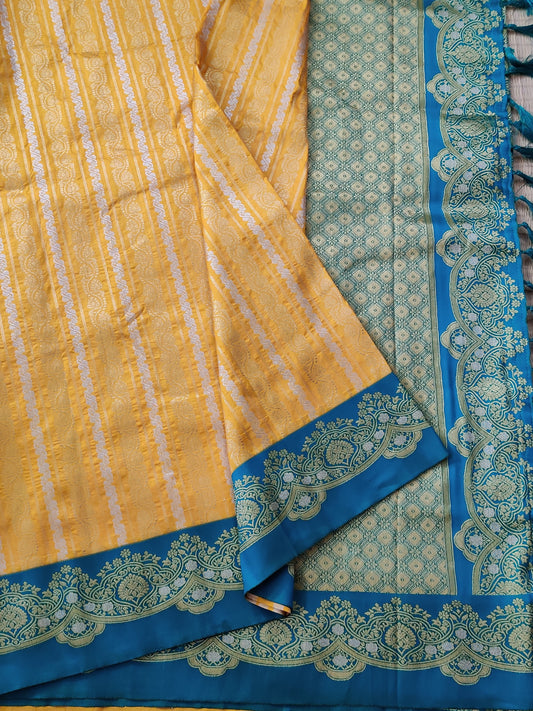 Yellow colour semi Banarasi saree with gold & silver zari stripes all over