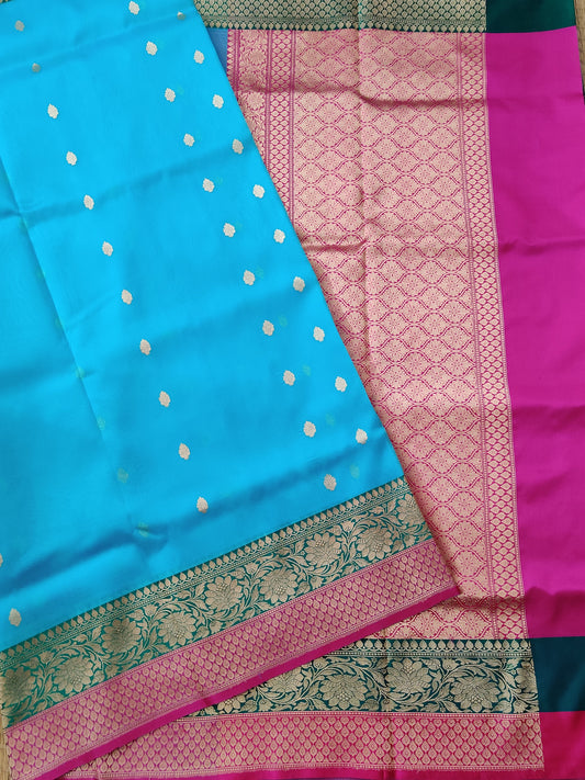 Sky blue colour organza silk saree with small zari butta all over