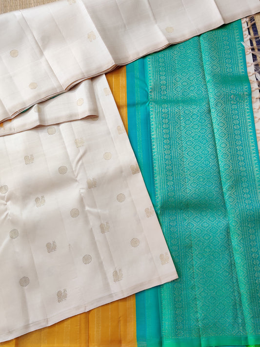Cream Colour Borderless Kanchivaram Silk Saree With Zari Peacock Motif All Over : KA0290