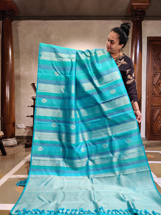 Turquoise Blue Colour Borderless Kanchivaram Silk Saree With Silver Zari Butta & Thread Woven Strips Body Code : KA0403