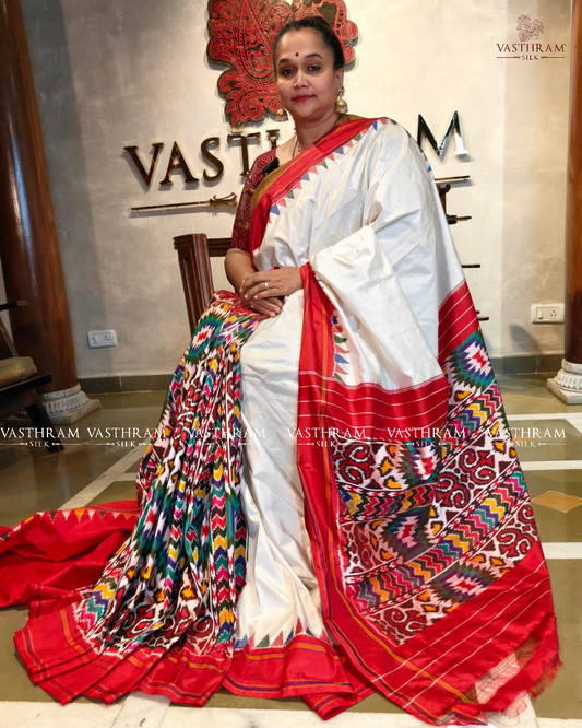 White colour usbek ikkat saree with ikkat weaving on the body