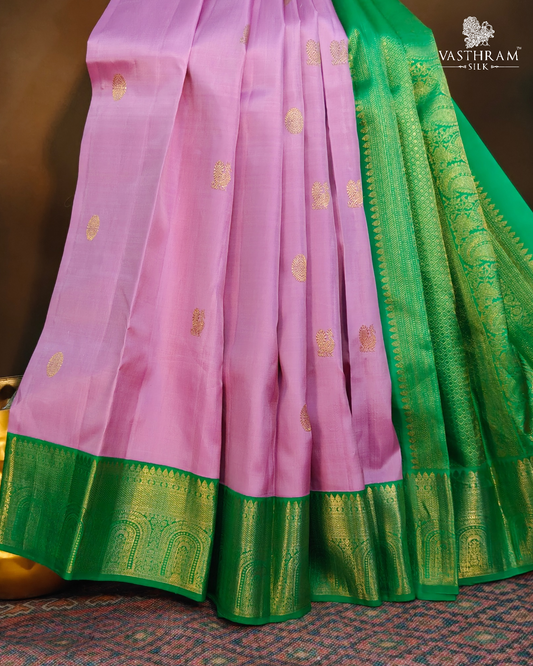 Pink colour kanchivaram silk saree with zari butta all over