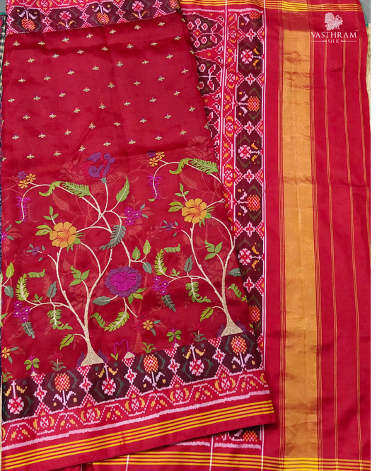 Red colour Kora Oraganza & Ikkat fusion silk saree with embroidery all over