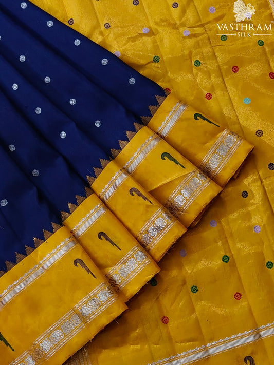 Navy blue colour gadwal silk saree with silver zari butta all over