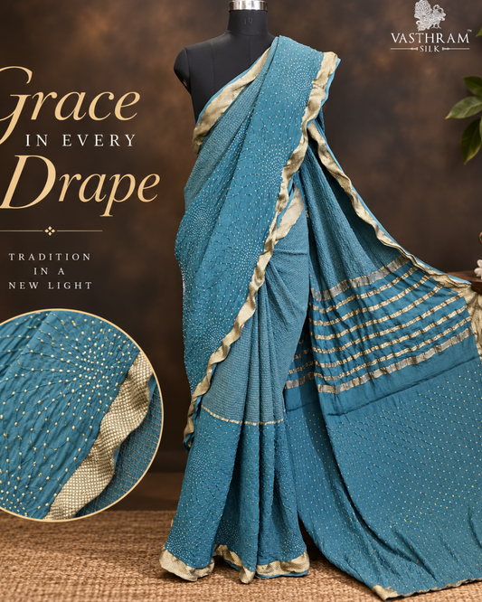 Greyish blue colour half/half mysore crepe silk saree with zari & hand bandhani all over