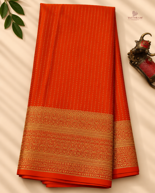 Orange colour crush mysore crepe silk saree with small zari butta all over