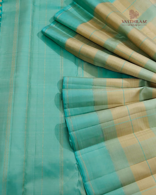 Yellow colour pure zari kanchivaram silk saree with checks all over