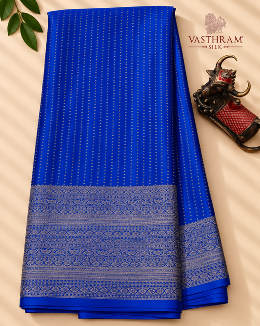Royal blue colour crush mysore crepe silk saree with small zari butta all over