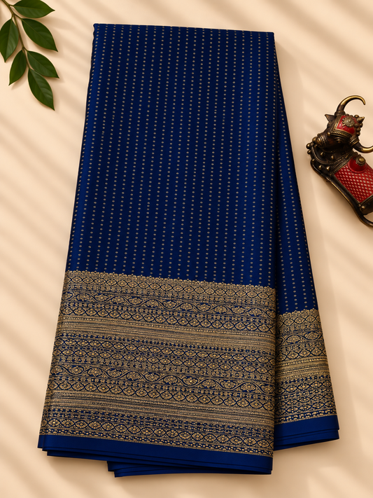 Navy blue colour crush mysore crepe silk saree with small zari butta all over