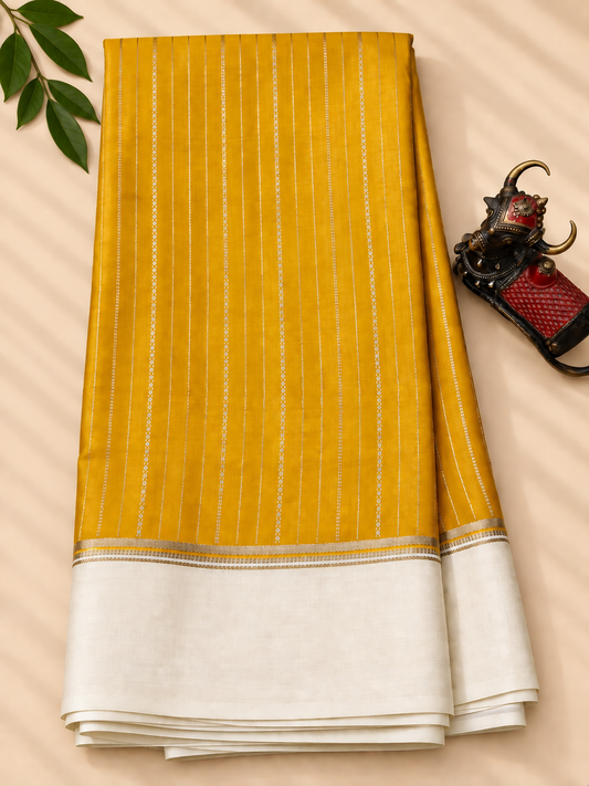 Yellow colour mysore crepe silk saree with zari stripes all over