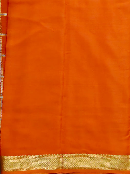 Orange colour mysore crepe silk saree with silver & gold zari checks all over