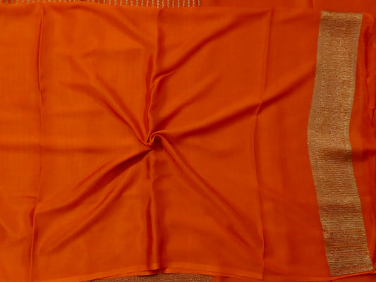 Orange colour crush mysore crepe silk saree with small zari butta all over