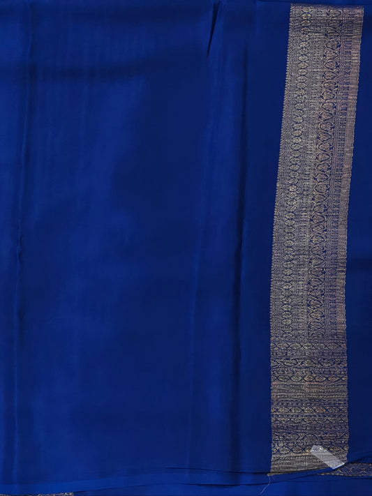 Navy blue colour crush mysore crepe silk saree with small zari butta all over