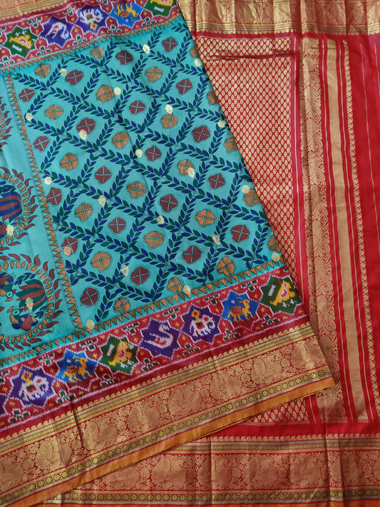 Sky Blue Colour Ikkat Silk Saree With Hand Madhubani Work All Over