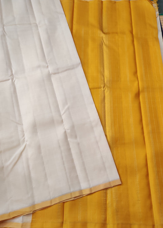 Cream Colour Borderless Kanchivaram Silk Saree With Plain Body  Code : KA083