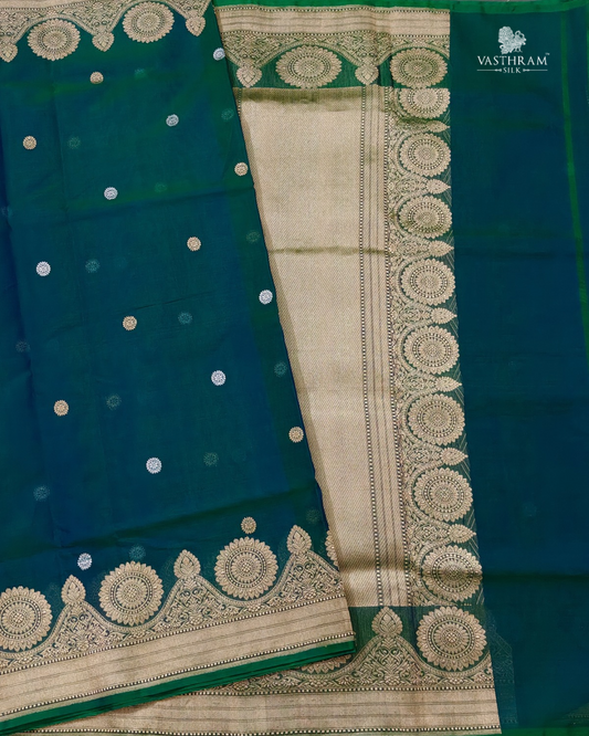 peacock green colour organza saree with zari butta all over
