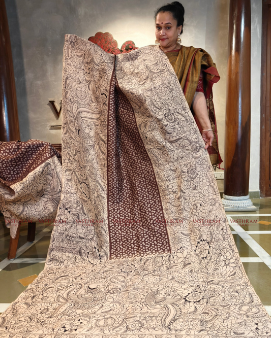 Cream & Brown colour ikkat silk saree with pen kalamkari & ikkat weaving all over
