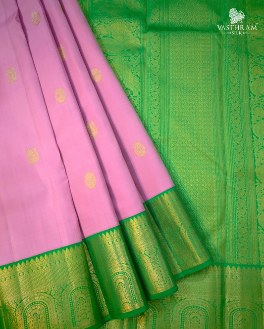 Pink colour kanchivaram silk saree with zari butta all over
