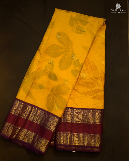Yellow colour kanchivaram silk saree with eco print all over