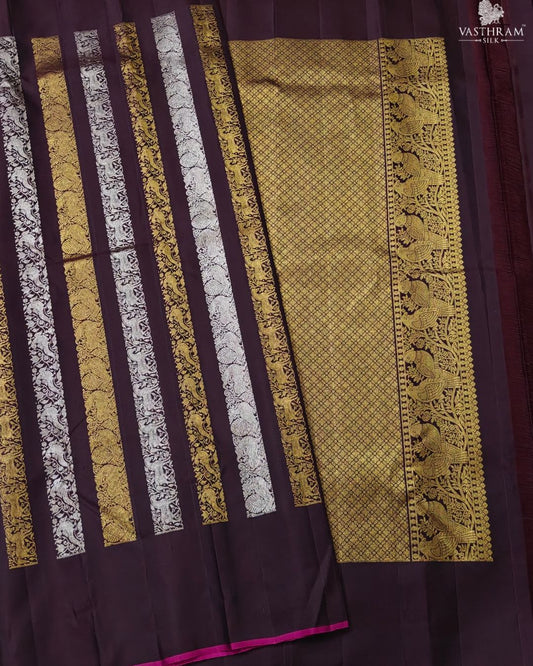 Brown colour kanchivaram silk saree with silver & gold zari stripes all over