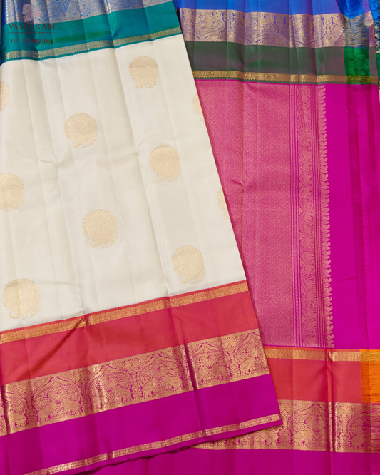 Cream colour kanchivaram silk saree with zari motif all over