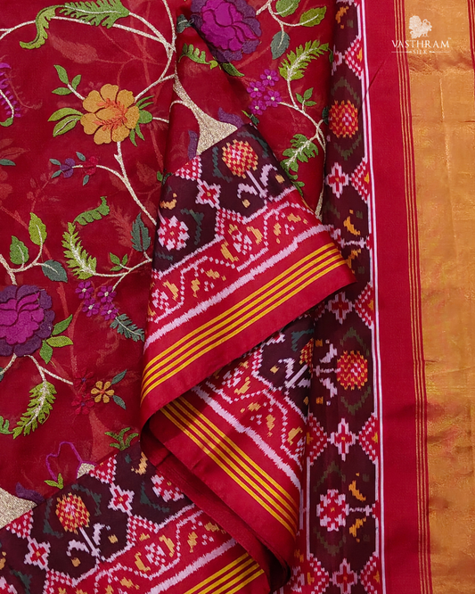 Red colour Kora Oraganza & Ikkat fusion silk saree with embroidery all over