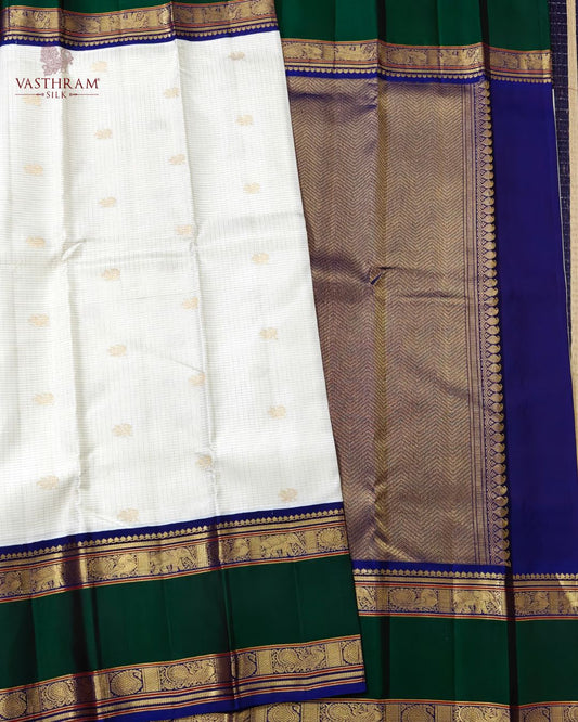 White colour kanchivaram silk saree with small zari checks & peacock zari motif all over Code : KA0502