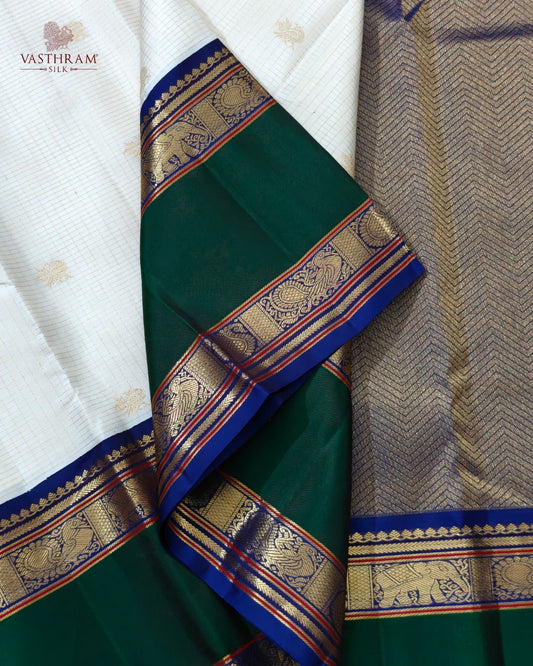 White colour kanchivaram silk saree with small zari checks & peacock zari motif all over Code : KA0502