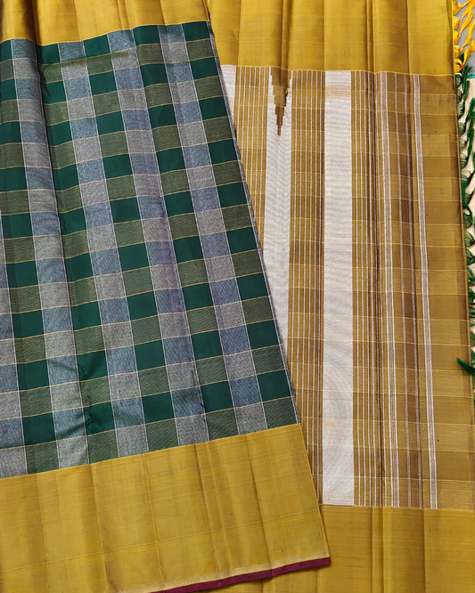 Green colour kanchivaram silk saree with silver and gold zari checks all over