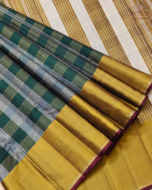 Green colour kanchivaram silk saree with silver and gold zari checks all over