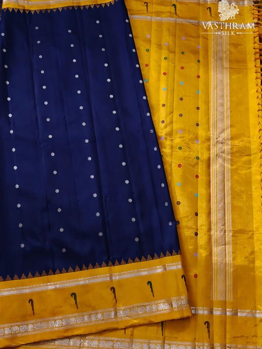 Navy blue colour gadwal silk saree with silver zari butta all over