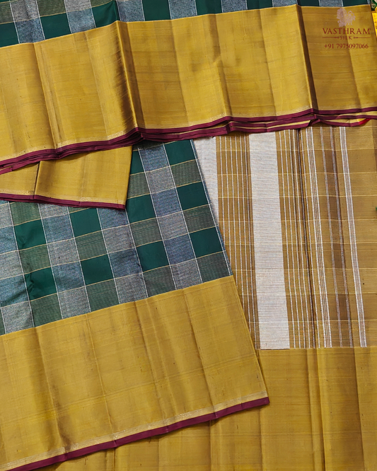 Green colour kanchivaram silk saree with silver and gold zari checks all over
